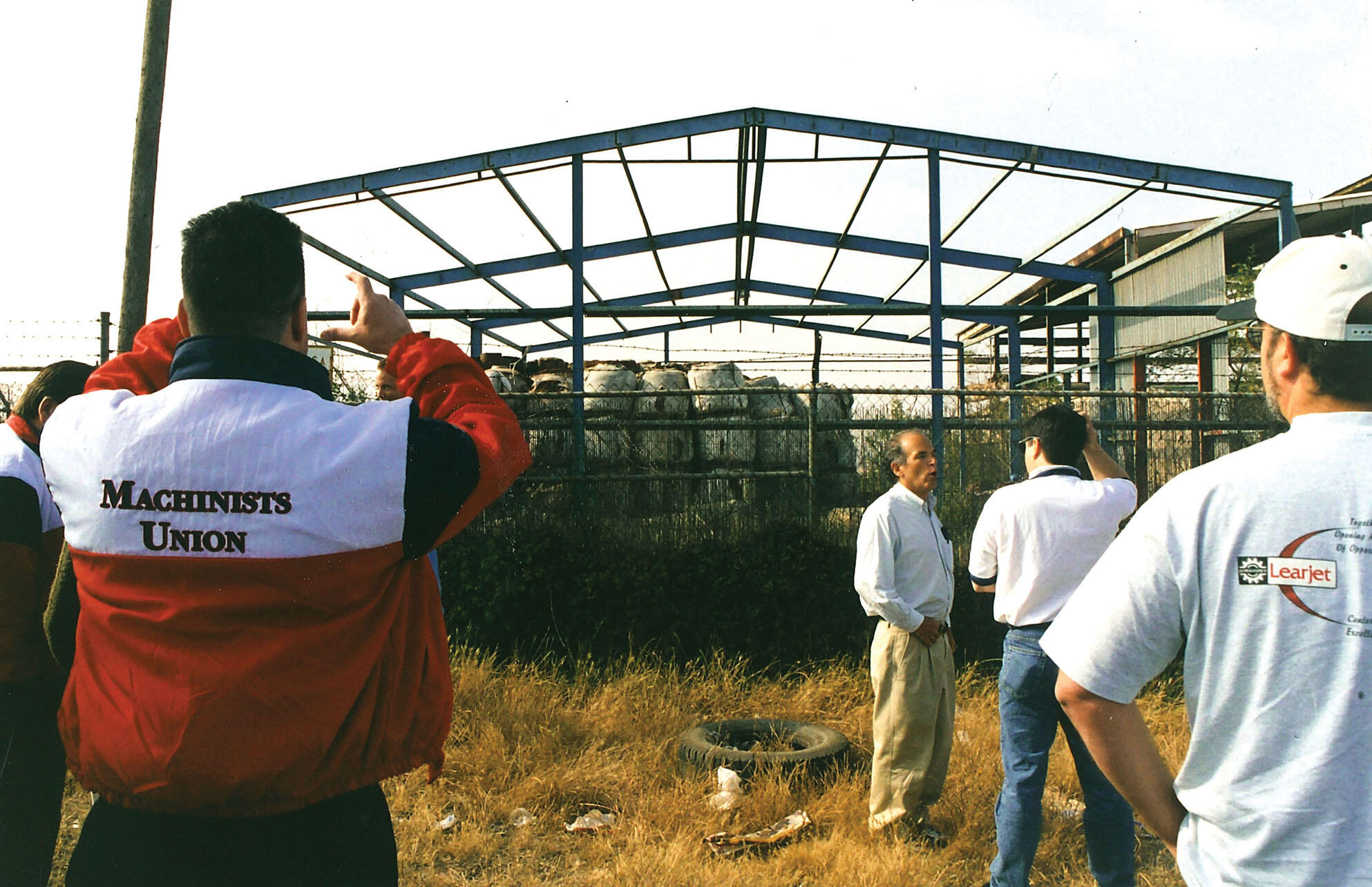 Harley Shaiken and members and leaders from the Machinists Union visit a toxic waste site left by the battery-recycling plant Metales y Derivados, on a ridge overlooking a densely populated neighborhood in Tijuana, Mexico. (Photo by CLAS staff.) Harley Shaiken and members and leaders from the Machinists Union visit a toxic waste site left by the battery-recycling plant Metales y Derivados, on a ridge overlooking a densely populated neighborhood in Tijuana, Mexico. (Photo by CLAS staff.)