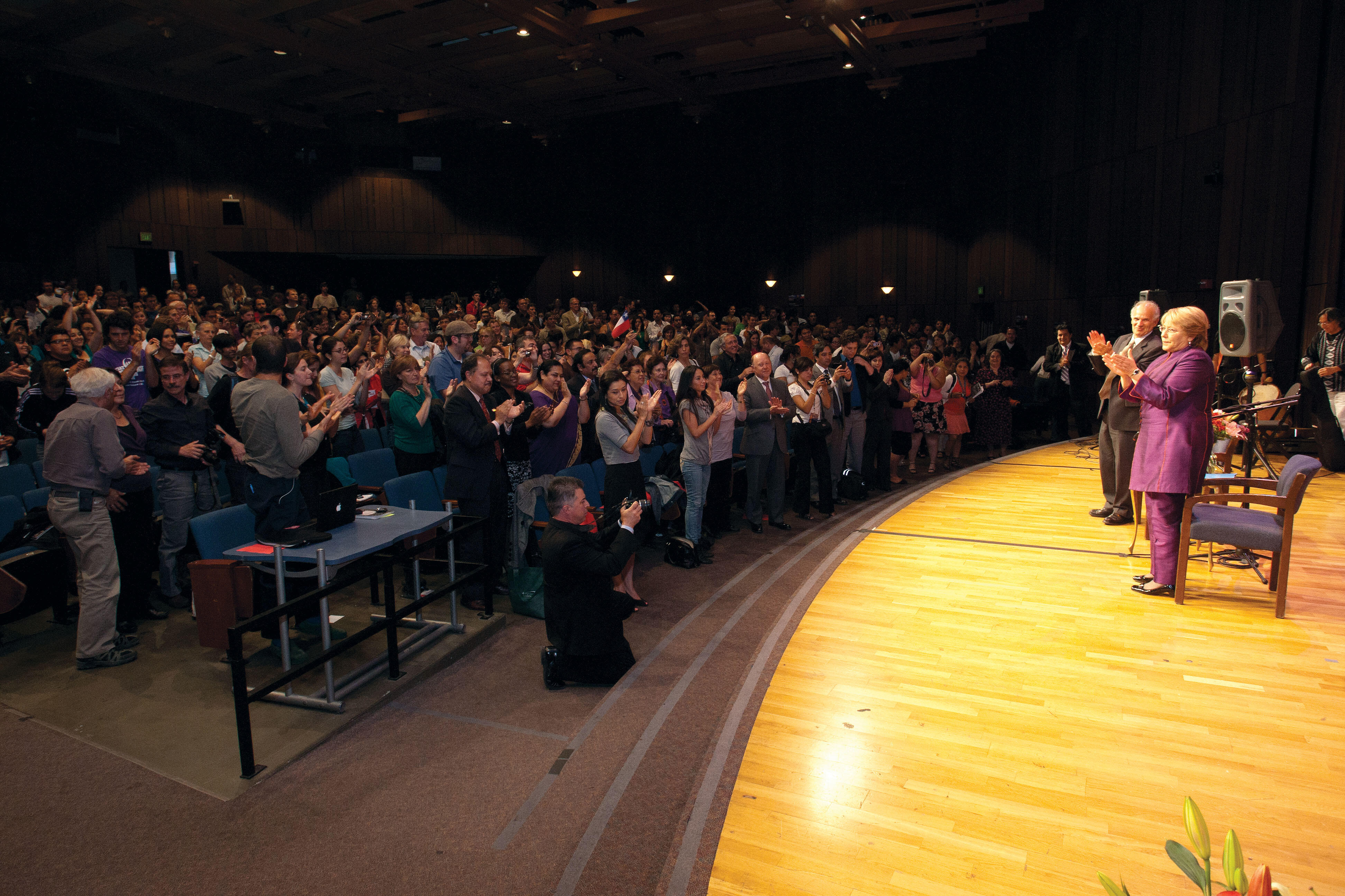 Michelle Bachelet responds to a standing ovation from the audience during her public talk. (Photo by Jim Block.)