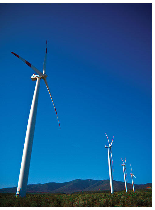 Against a backdrop of blue sky and mountains, the windmills of the Canela Wind Park represents Chile’s commitment to sustainable development. (Photo by Nelson Condeza.) 