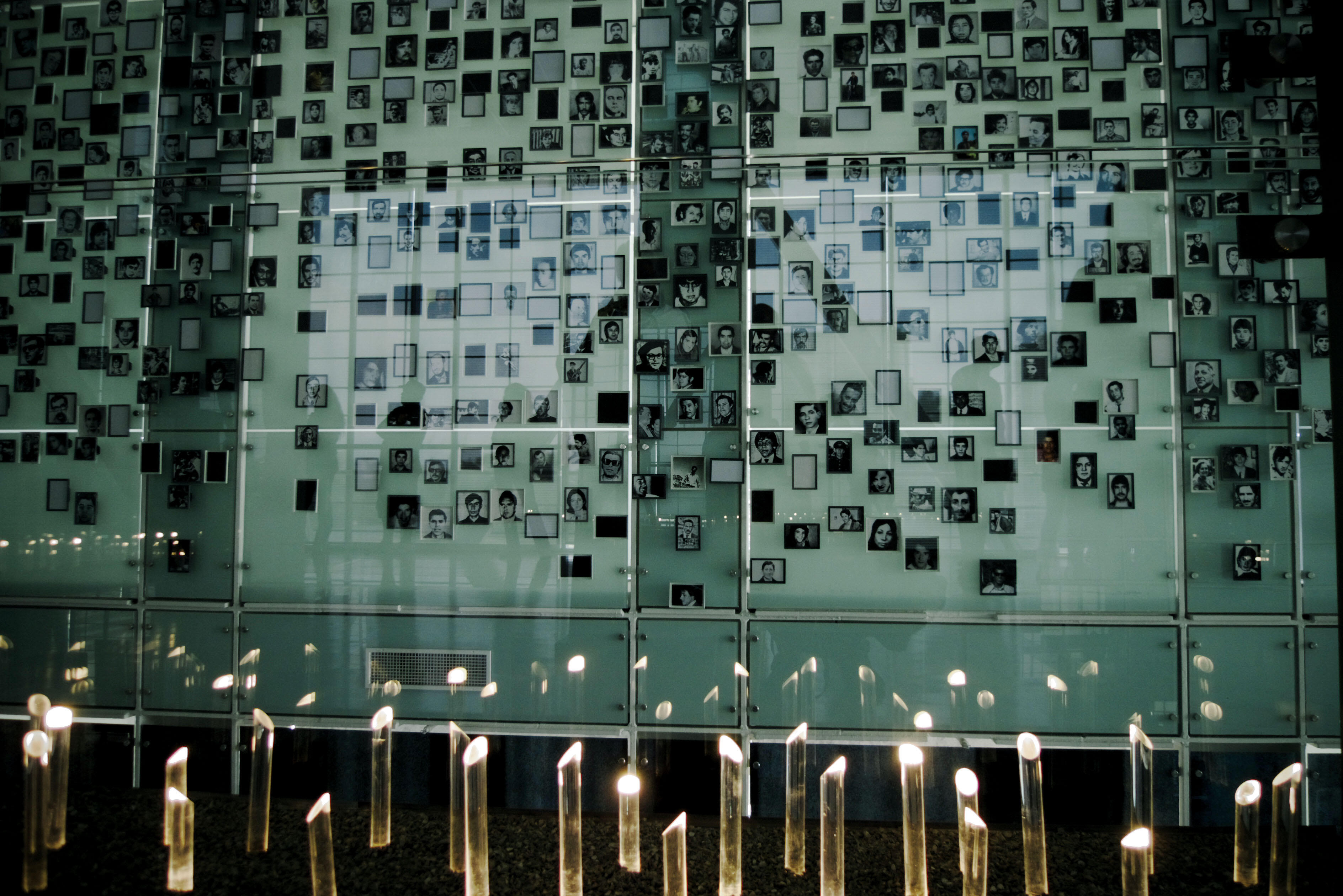 A memorial wall of photos of the murdered and disappeared from the dictatorship, displayed in Chile’s Museum of Memory and Human Rights, which was commissioned by President Michelle Bachelet. (Photo by Francisco Javier Cornejos.)