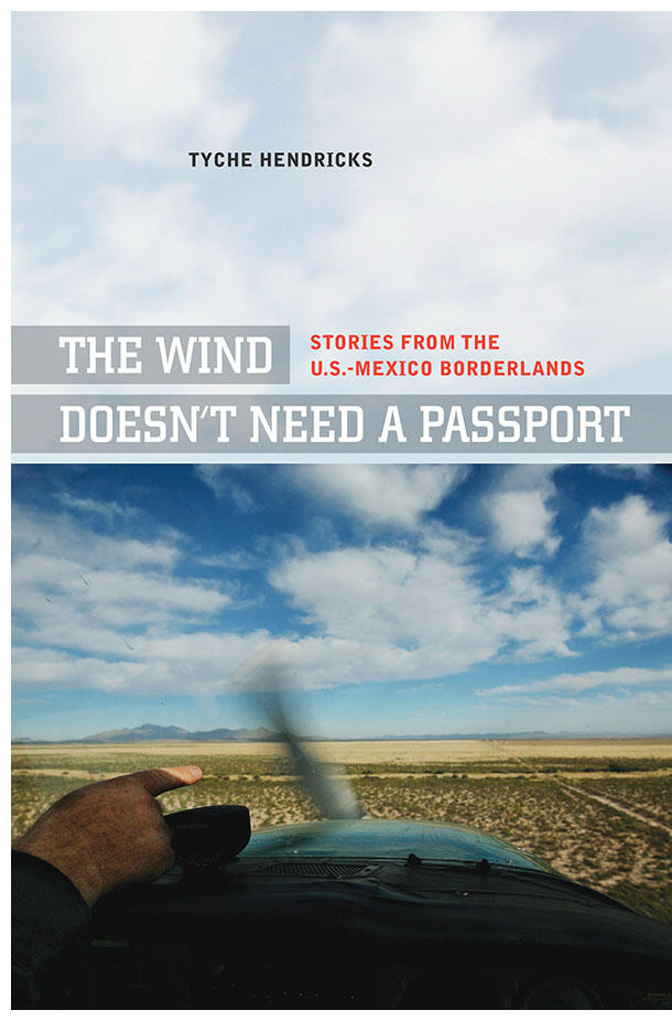 A man points out the border from a plane on the cover of "The Wind Doesn't Need a Passport," by Tyche Hendricks. (Photo by Sandy Huffaker Jr. )