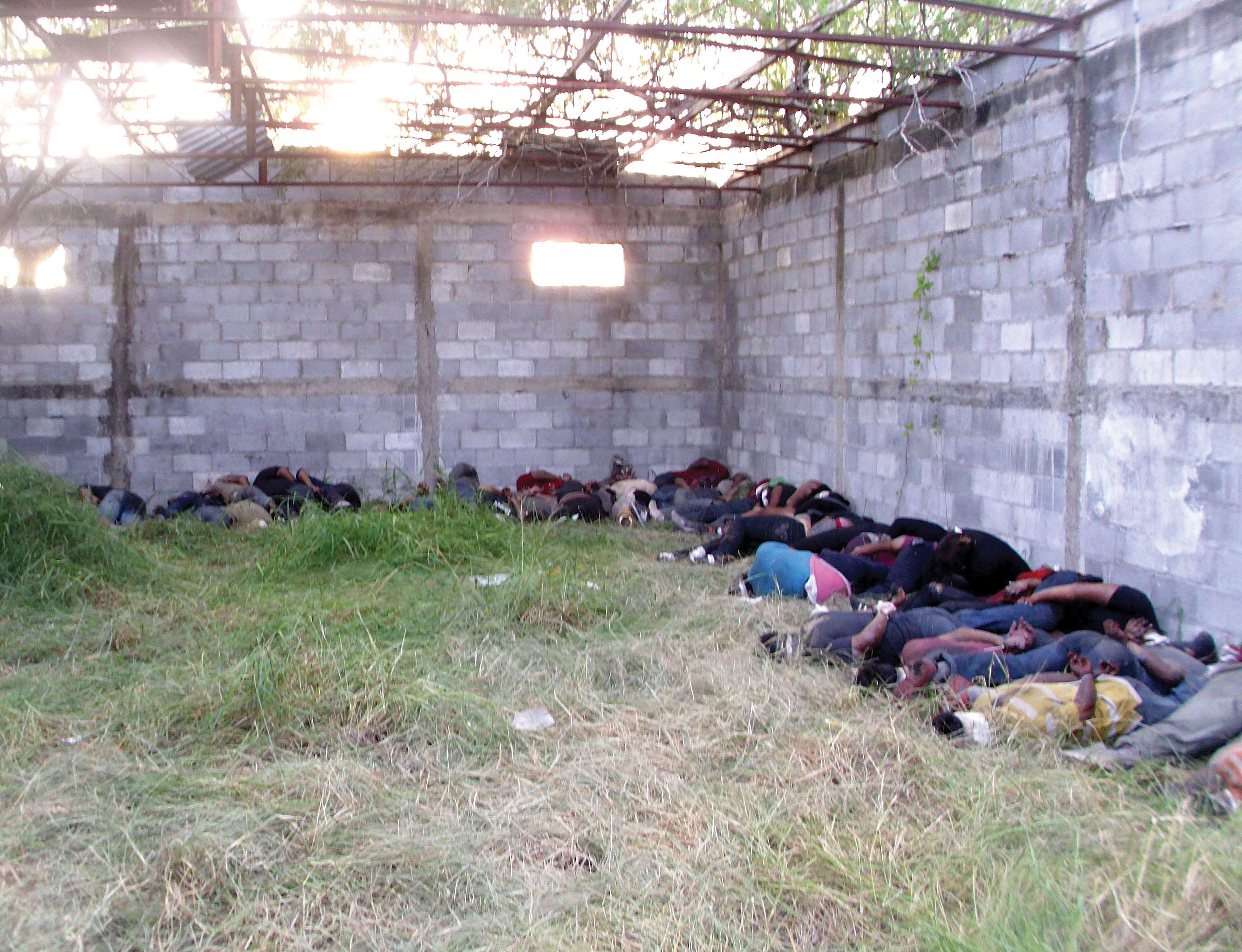 The bodies of 72 migrants allegedly killed by the Zetas drug gang were found in August 2010 in San Fernando, Tamaulipas. (Photo from the Associated Press/El Universal.)