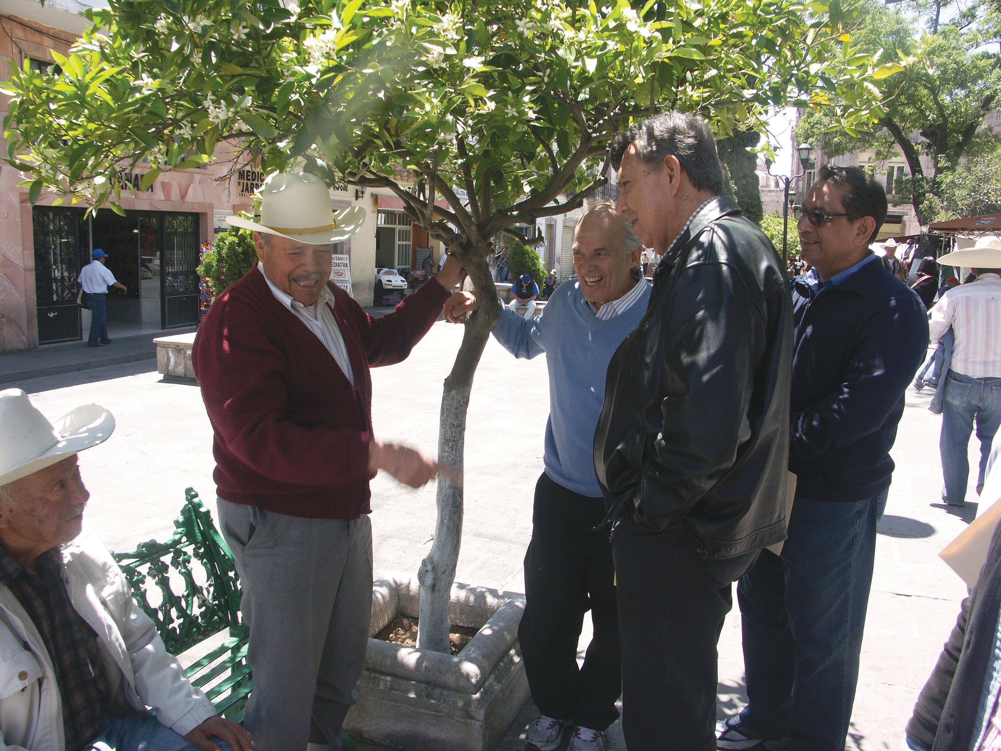 Harley Shaiken, Cuauhtémoc Cárdenas. and Gil Cedillo speak with local residents in the main plaza in Jerez, Mexico. (Photo by Dionicia Ramos.)