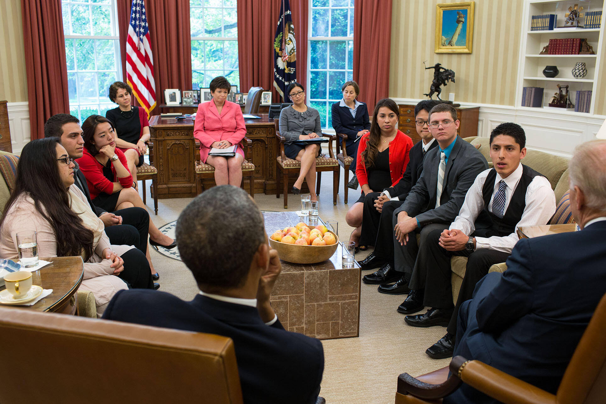President Obama and Vice President Biden meet with DREAMers who have received Deferred Action and U.S. citizen family members of undocumented immigrants in the Oval Office, May 2013. (Photo by Pete Souza/Official White House Photo.)