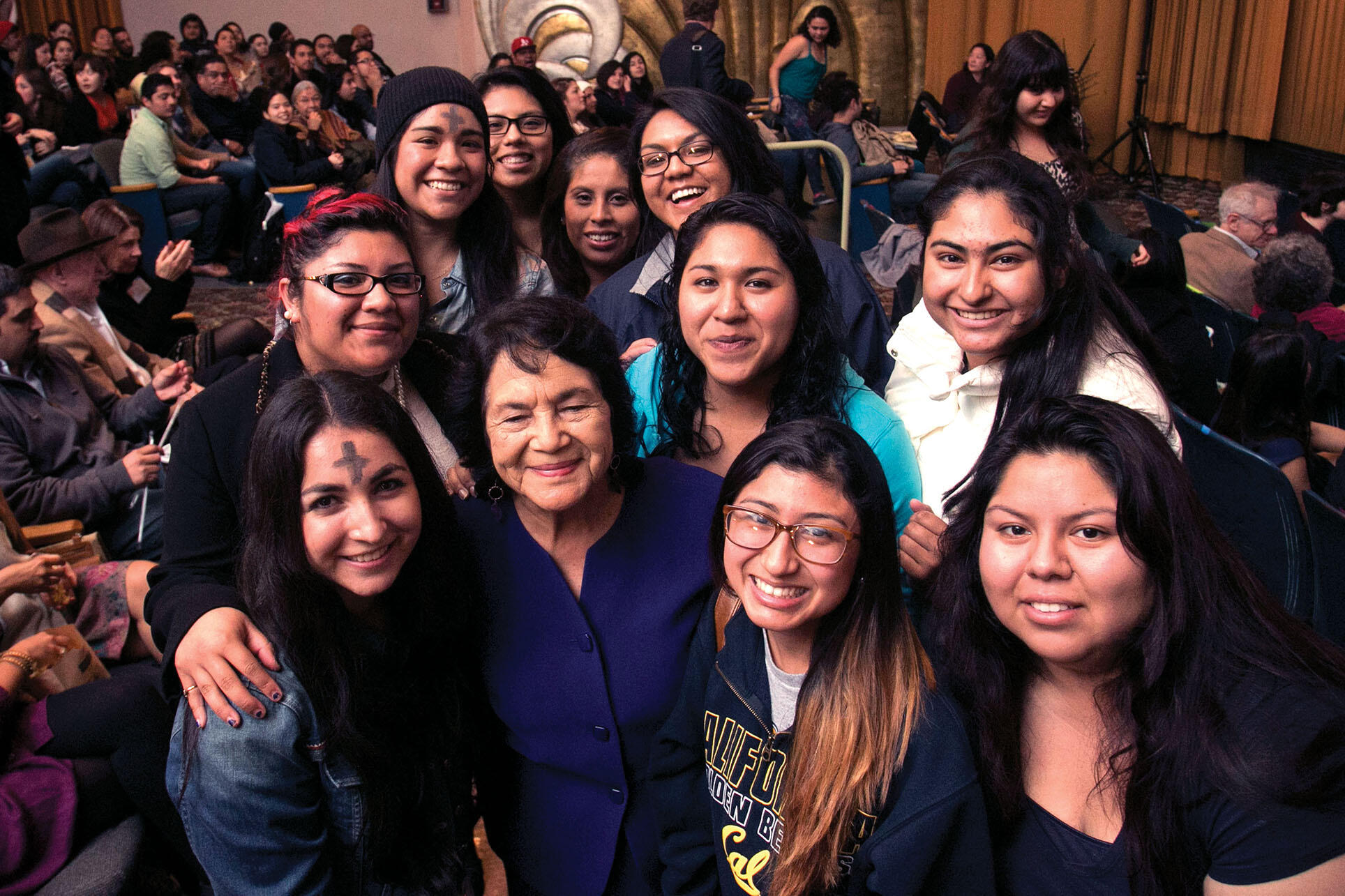 Dolores Huerta surrounded by young women at the screening of  “Cesar Chavez.” (Photo by Jim Block.)