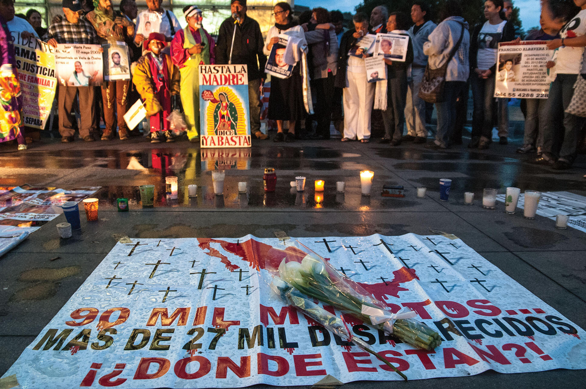 Candles and flowers mark a 2013 commemoration of those killed in Mexico’s ongoing violence. (Photo by Eneas de Troya.)