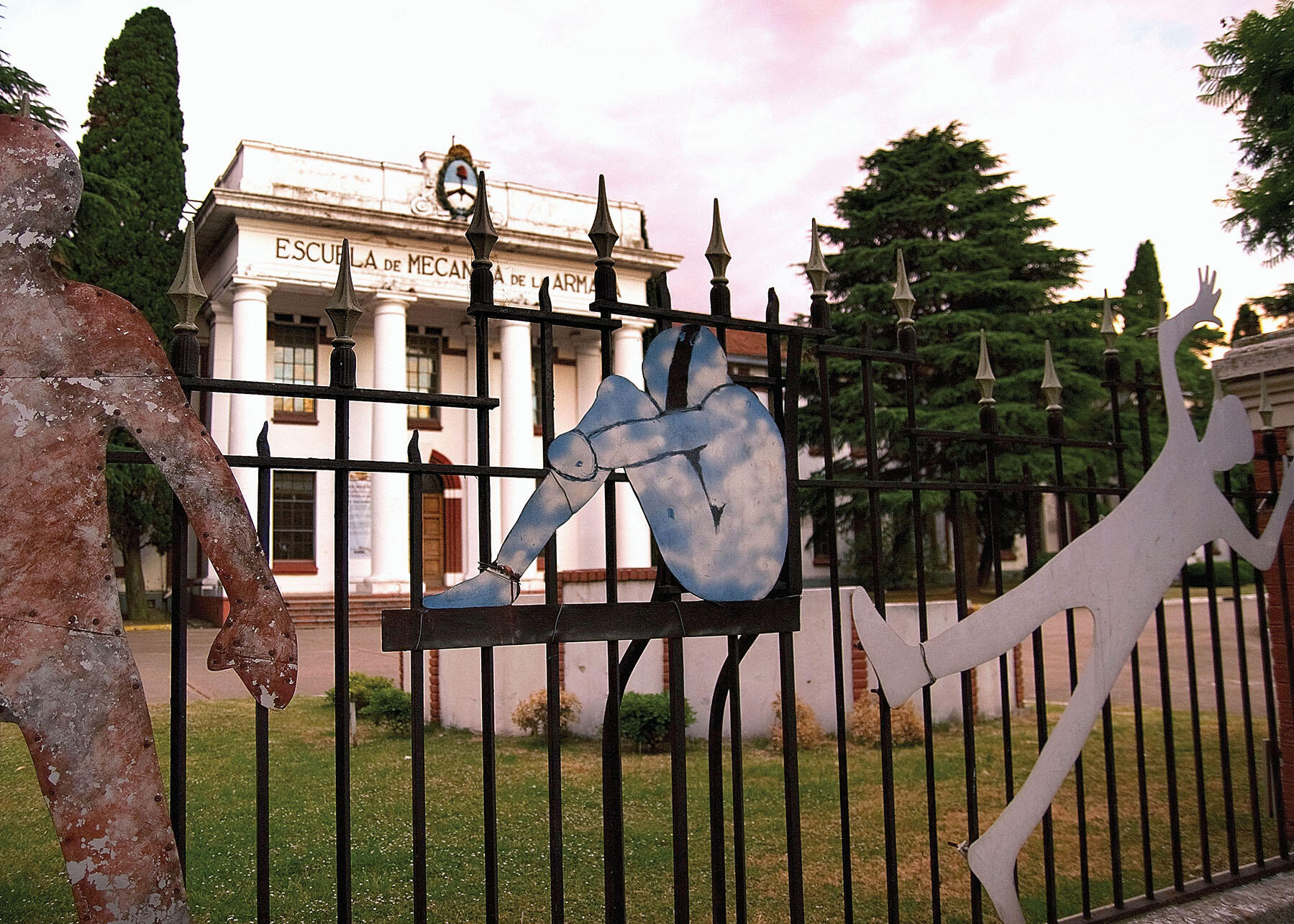 Metal figures welded to a fence form a memorial to torture victims in front of Argentina’s Escuela de Mecánica de la Armada (ESMA). (Photo by David A. Wilbanks.)