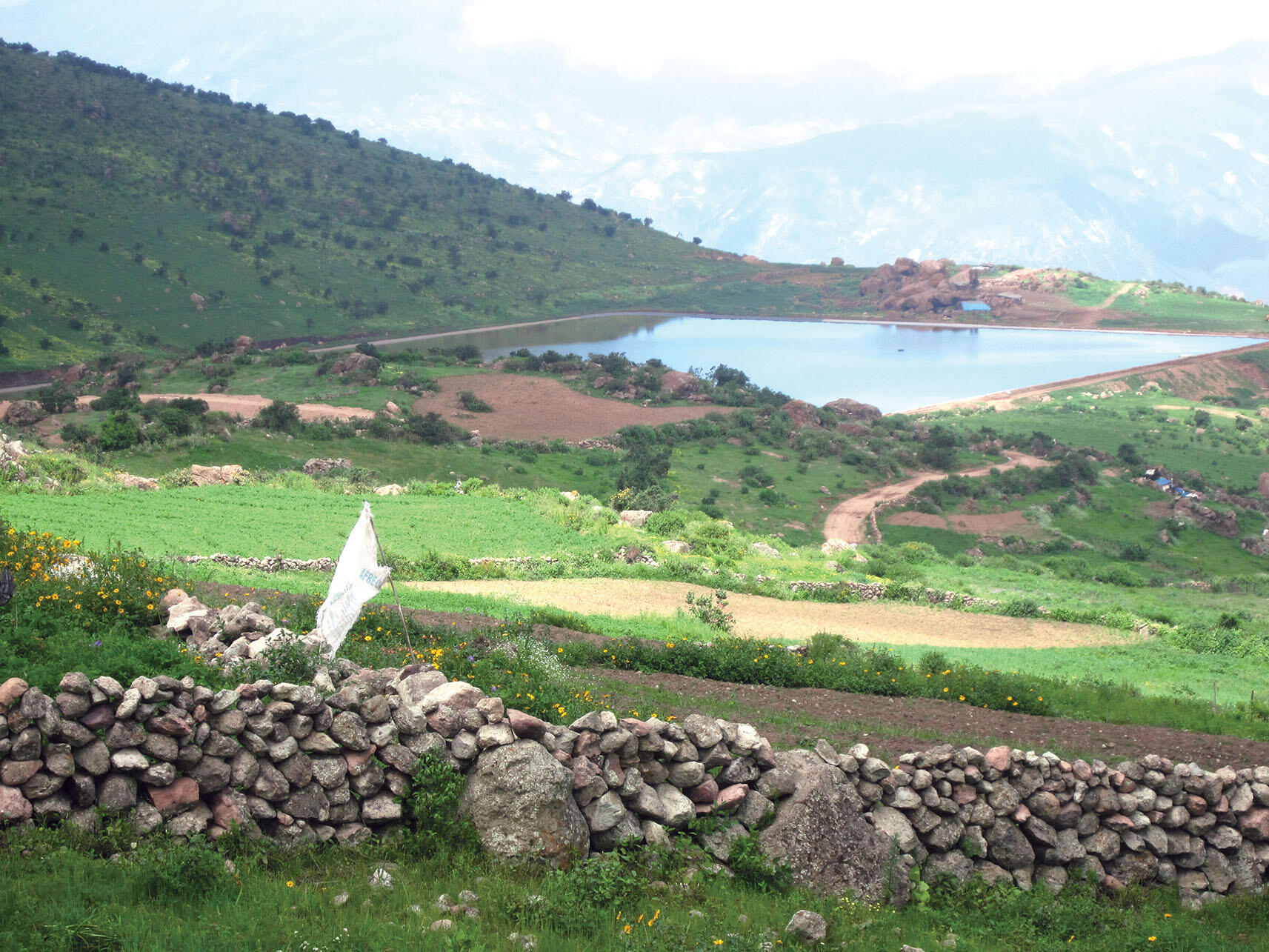 A reservoir that forms part of the water system of Tupicocha, Peru. (Photo by Sergio Montero.) A hillside reservoir that forms part of the water system of Tupicocha, Peru. (Photo by Sergio Montero.)