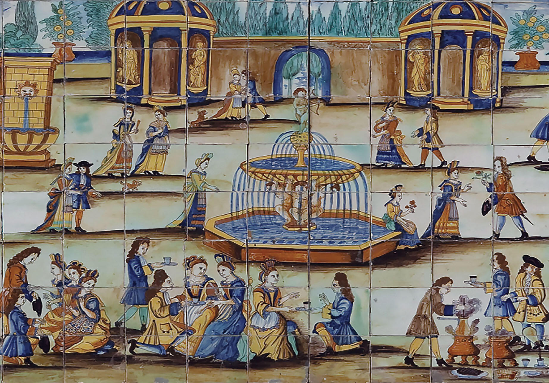 Painted blue and white tiles show scenes of chocolate drinking in Spain in the early 18th century. (Photo courtesy of the Collection of the Museo de Cerámica de Barcelona, Museu del Disseny de Barcelona.)