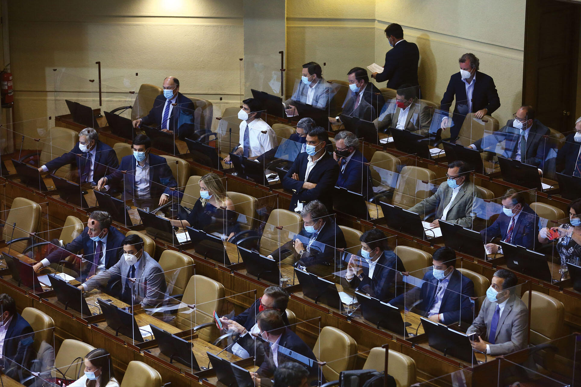 Members of Chile’s Congress sit at their divided desks to discuss constitutional reform during the pandemic, November 2020. (Photo by Vivian Morales C.)