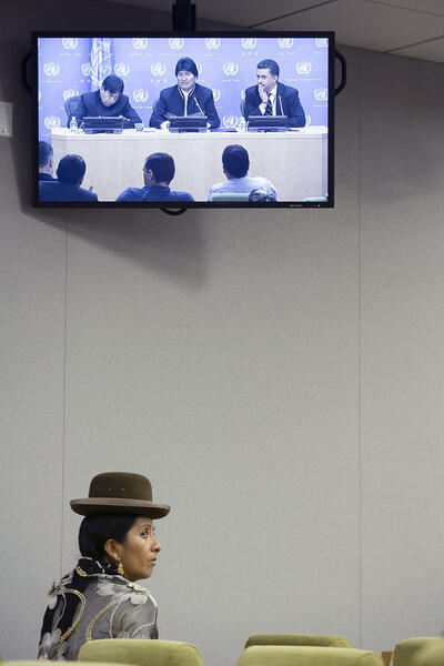 A woman in traditional Bolivian clothing watches Bolivian president Evo Morales at the United Nations. (Photo by Manuel Elia/UN Photo.)