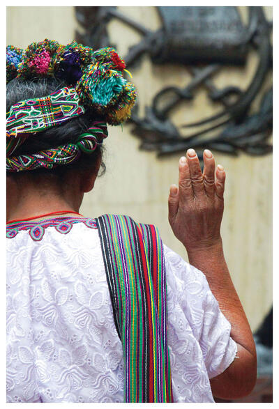 A Mayan woman in traditional dress stands to be sworn in as she testifies at the trial of Efraín Ríos Montt in Guatemala. (Photo by trocalre.) A Mayan woman in traditional dress stands to be sworn in as she testifies at the trial of Efraín Ríos Montt in Guatemala. (Photo by trocalre.)