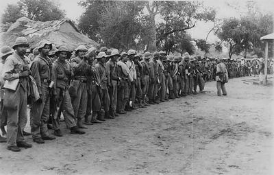 In a black and white photo from 1932, Paraguayan soldiers in Alihuatá, site of two major battles during the Chaco War. (Photo by Doctor Carlos De Sanctis/Wikimedia.)