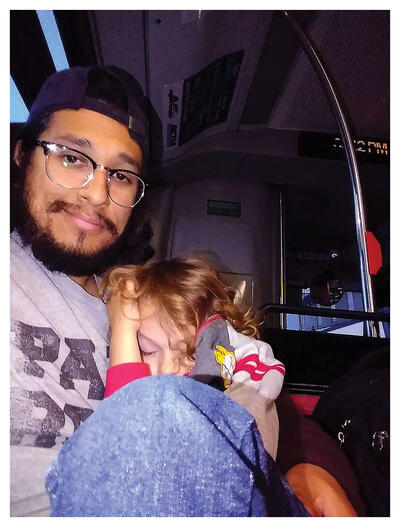 The author Everardo Reyes and his son riding the bus after Nahuatl class. (Photo by Everardo Reyes.)